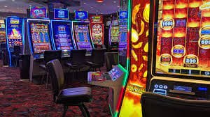 747 bet slot game reels spinning on a mobile device held by a Filipino player